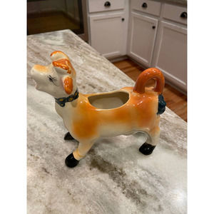 So adorable vintage mid-century cow pitcher. Liquid pours from cow's mouth.